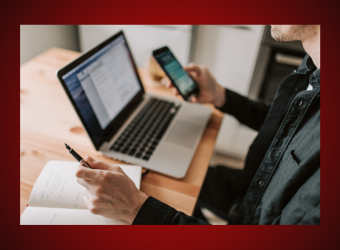 Person on the computer, looking at cell phone instructional content